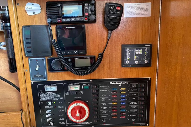 Slide: The Image of Electrical control panel of a 2006 Catalina 309 yacht with navigation and communication equipment. - 15