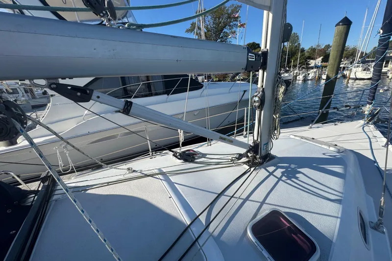 Slide: The Image of 2006 Catalina 309 sailboat deck with rigging in a marina setting. - 21