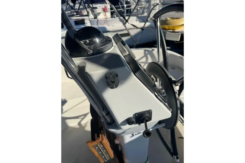 Slide: The Image of Steering wheel and controls of a 2006 Catalina 309 sailboat cockpit. - 24