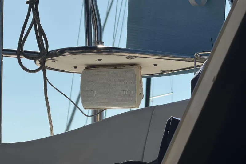 Slide: The Image of Speaker mounted on a 2006 Catalina 309 sailboat, with ropes and metal railings visible. - 26