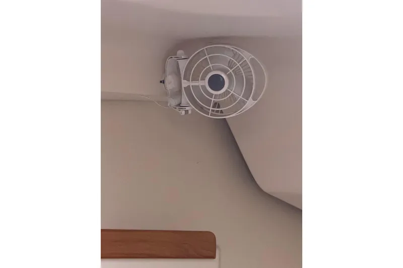 Slide: The Image of Ceiling-mounted fan inside a 2006 Catalina 309 boat cabin. - 32