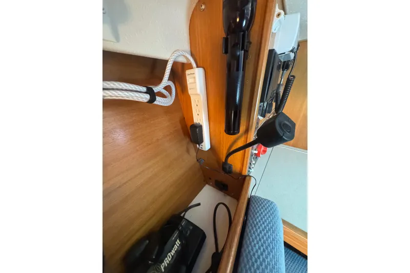 Slide: The Image of Interior of a 2006 Catalina 309 sailboat showing electrical outlets and equipment. - 37