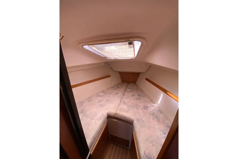 Slide: The Image of Cozy interior cabin of a 2006 Catalina 309 sailboat with a skylight. - 4