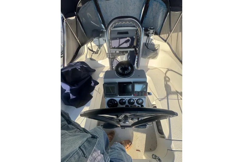 Slide: The Image of Cockpit view of a 2006 Catalina 309 sailboat with navigation instruments. - 56