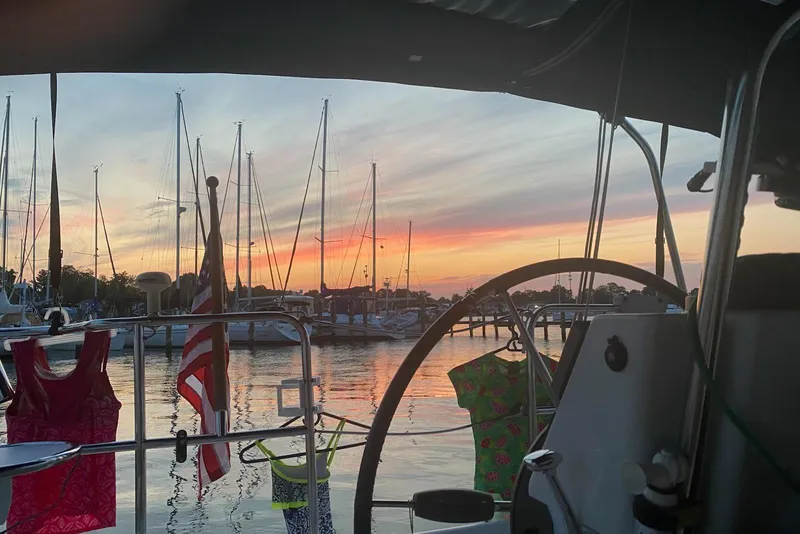 Slide: The Image of Sailboat cockpit view at sunset, Catalina 309, 2006, with colorful clothes drying. - 6