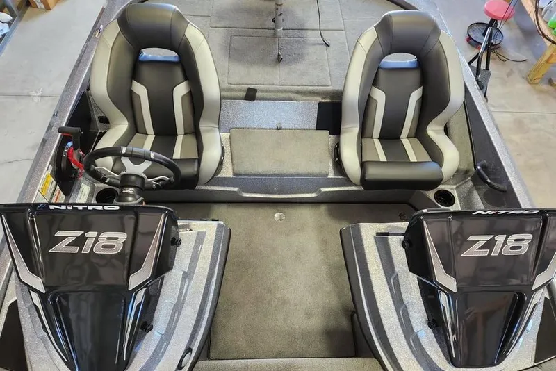 Slide: The Image of Interior of 2026 Nitro Z18 Pro boat with dual seats and steering wheel. - 12