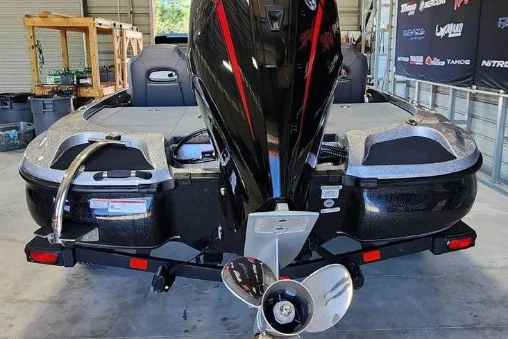 Slide: The Image of 2026 Nitro Z18 Pro boat in a garage, showcasing its sleek design and powerful motor. - 2
