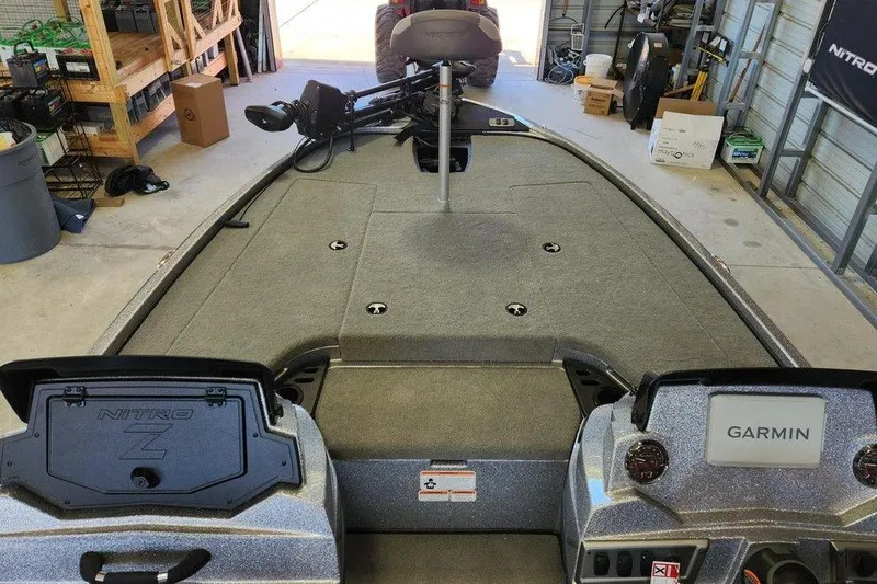 Slide: The Image of 2026 Nitro Z18 Pro boat interior with Garmin system in a garage setting. - 8