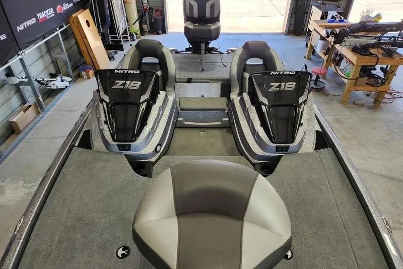 Slide: The Image of 2026 Nitro Z18 Pro boat interior with dual seats in a garage setting. - 9