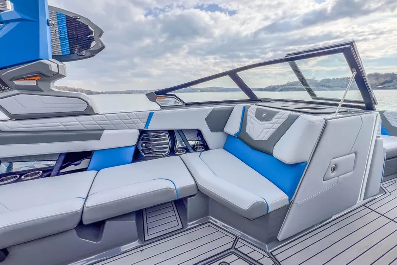 Slide: The Image of 2022 Nautique Super Air Nautique G23 interior with modern seating and sleek design. - 18