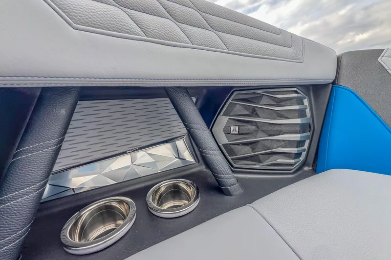 Slide: The Image of Interior of 2022 Nautique Super Air Nautique G23 with speaker and cup holders. - 26