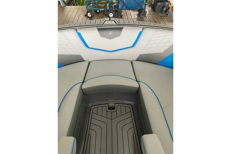 Slide: The Image of 2022 Nautique Super Air Nautique G23 boat cruising on a calm lake. - 6
