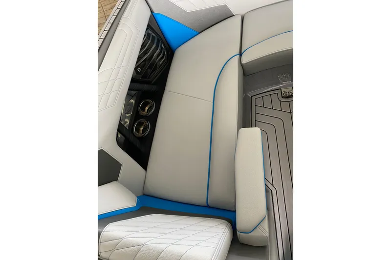 Slide: The Image of 2022 Nautique Super Air Nautique G23 boat on a lake with autumn trees in the background. - 7