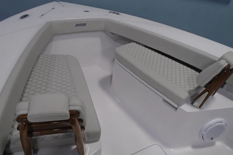 Slide: The Image of Luxurious seating area on a 2026 Jupiter 32 boat with cushioned benches. - 16