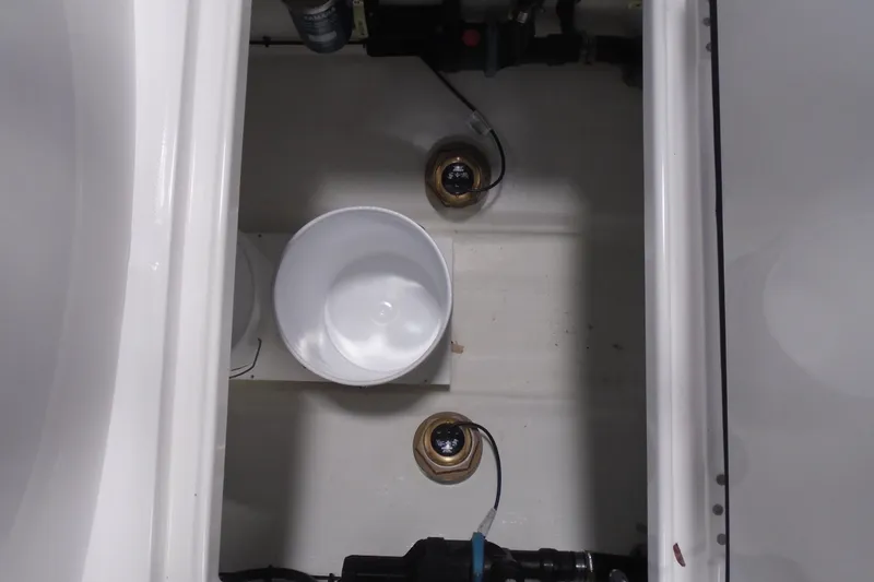 Slide: The Image of Interior view of a 2026 Jupiter 32 boat compartment with wiring and components. - 26