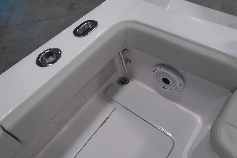 Slide: The Image of Interior of 2026 Jupiter 32 boat featuring cup holders and speaker. - 28