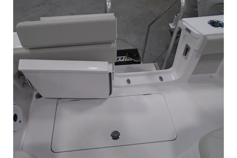 Slide: The Image of Jupiter 32 boat interior, featuring sleek white seating and storage, 2026 model. - 30