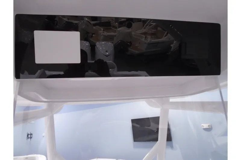 Slide: The Image of Control panel of a 2026 Jupiter 32 boat, featuring a sleek black and white design. - 31