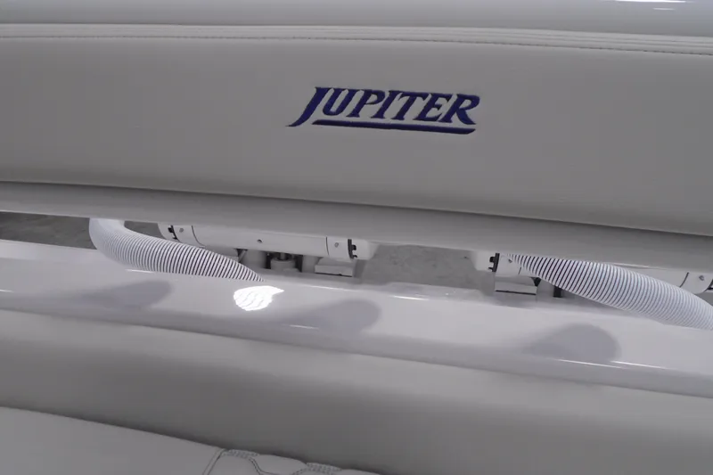 Slide: The Image of Jupiter 32 boat interior detail, featuring sleek white seating, 2026 model. - 38