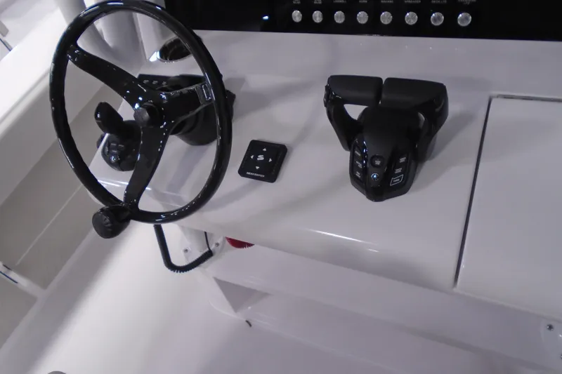 Slide: The Image of Steering wheel and controls of 2026 Jupiter 32 boat cockpit. - 8