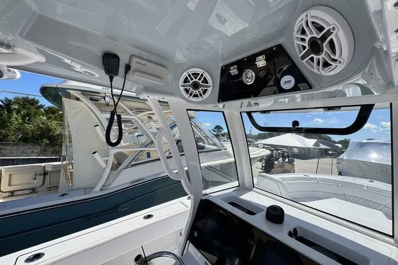 Slide: The Image of 2026 Sportsman Heritage 261 Center Console interior with speakers and control panel. - 21