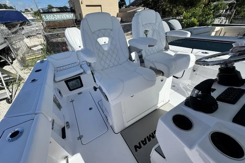 Slide: The Image of 2026 Sportsman Heritage 261 Center Console with white seating and modern dashboard. - 25