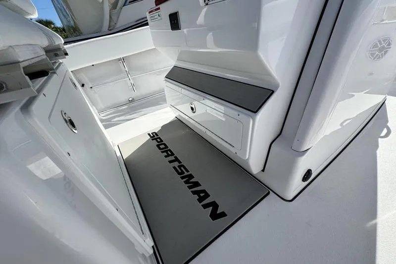 Slide: The Image of 2026 Sportsman Heritage 261 Center Console interior with branded mat and storage compartments. - 27