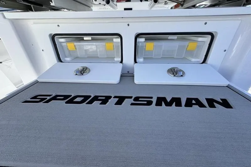 Slide: The Image of 2026 Sportsman Heritage 261 Center Console with storage compartments and logo. - 34