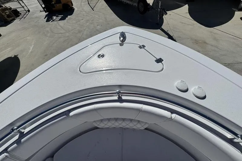 Slide: The Image of 2026 Sportsman Heritage 261 Center Console boat bow with seating and storage compartment. - 4