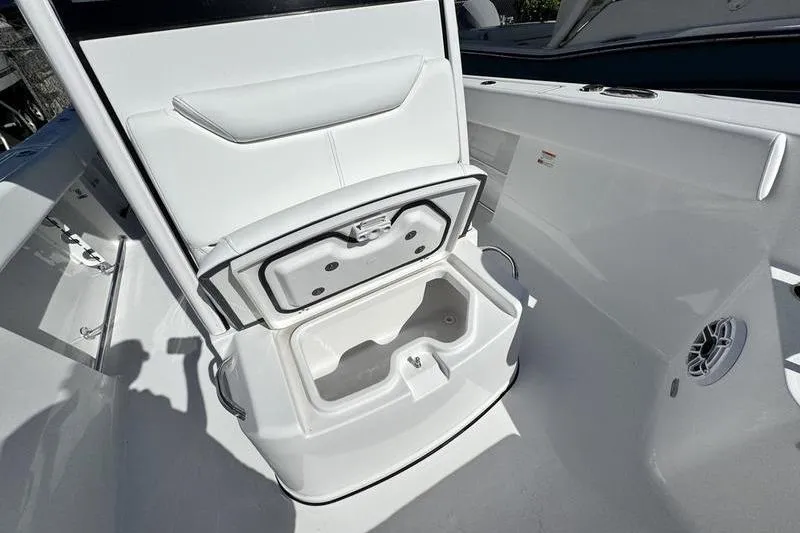 Slide: The Image of 2026 Sportsman Heritage 261 Center Console boat with open storage compartment. - 9