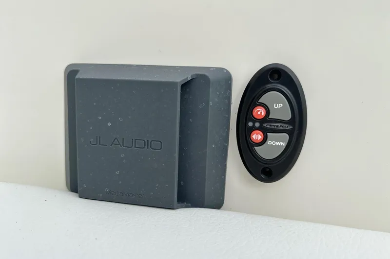 Slide: The Image of JL Audio control panel and Power-Pole buttons on 2025 Pathfinder 2600 TRS boat. - 12