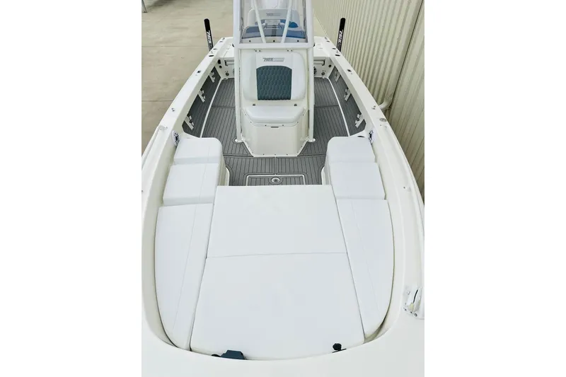 Slide: The Image of 2025 Pathfinder 2600 TRS boat interior with white seating and sleek design. - 13