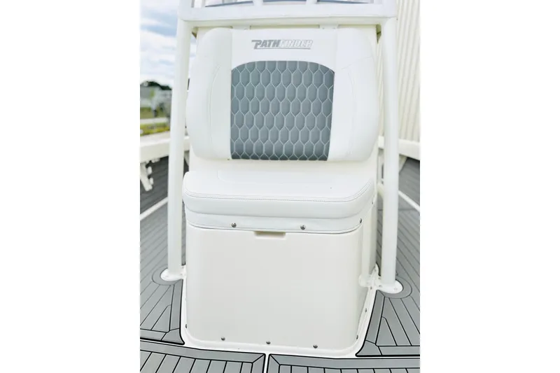 Slide: The Image of 2025 Pathfinder 2600 TRS boat seat with hexagonal pattern and white cushioning. - 15