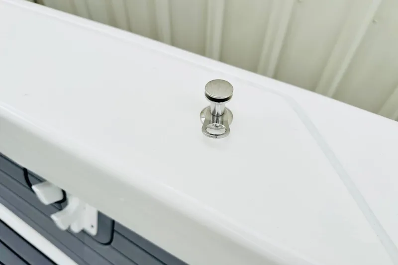 Slide: The Image of 2025 Pathfinder 2600 TRS boat cleat on white deck, close-up view. - 18
