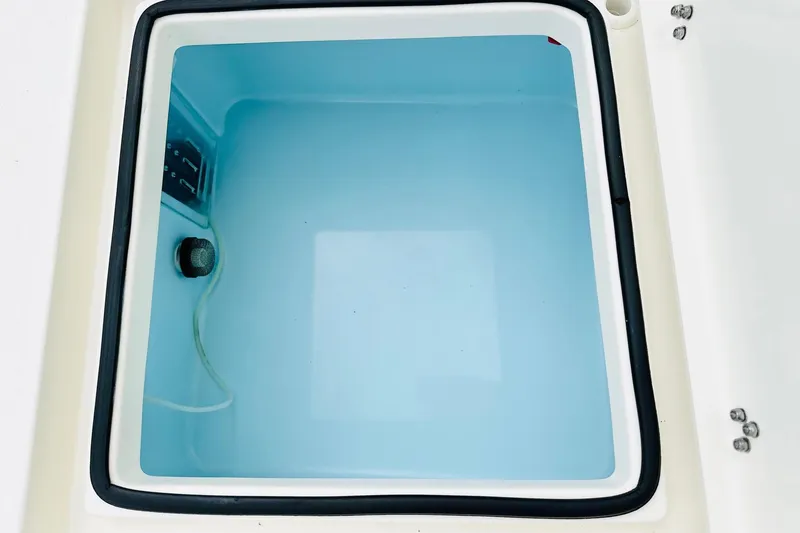 Slide: The Image of Livewell compartment of 2025 Pathfinder 2600 TRS boat, filled with water. - 23