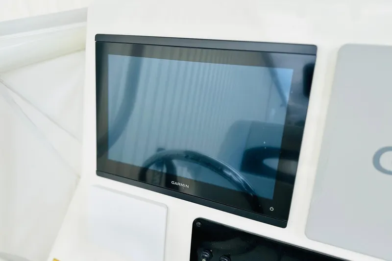 Slide: The Image of Garmin display on 2025 Pathfinder 2600 TRS boat dashboard. - 3