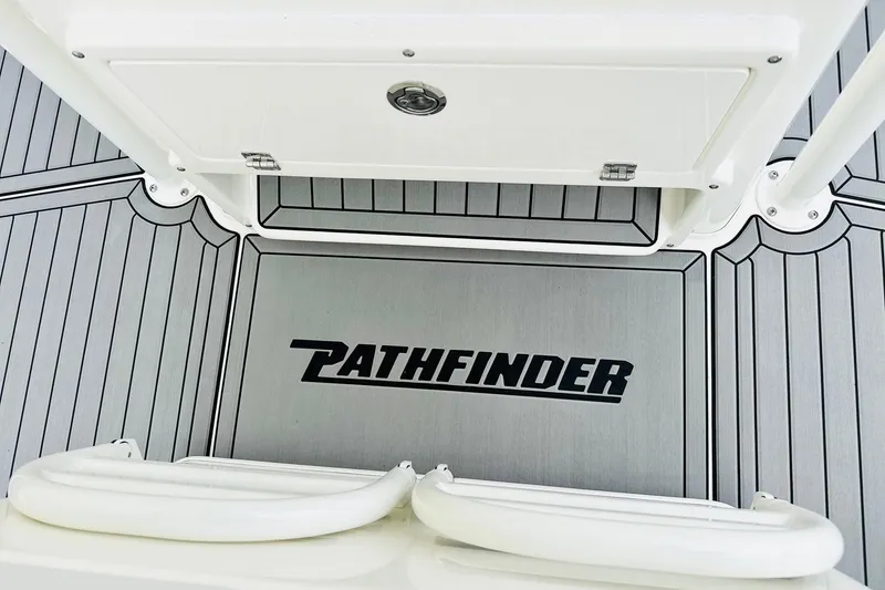 Slide: The Image of 2025 Pathfinder 2600 TRS boat deck with logo and storage compartment. - 5