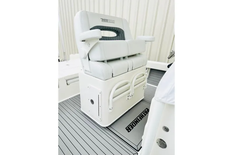 Slide: The Image of 2025 Pathfinder 2600 TRS boat seat with white upholstery and integrated storage. - 6