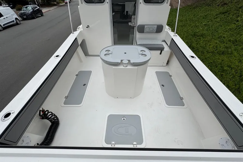 Slide: The Image of 2026 Defiance Admiral 220 EX boat interior with seating and storage compartments. - 14