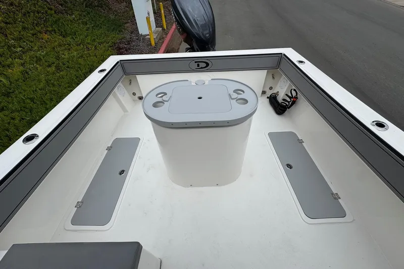 Slide: The Image of 2026 Defiance Admiral 220 EX boat interior with storage compartments and seating area. - 15