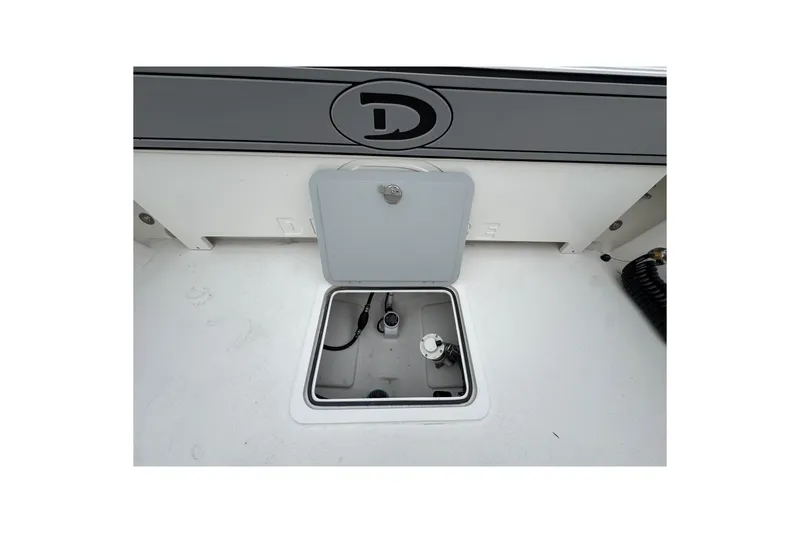 Slide: The Image of Open hatch on 2026 Defiance Admiral 220 EX boat deck, showing interior compartment. - 17