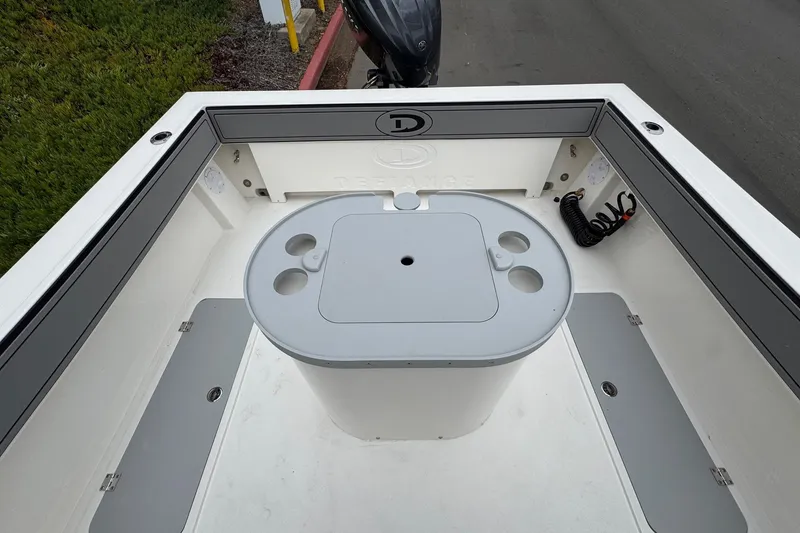Slide: The Image of Interior view of 2026 Defiance Admiral 220 EX boat with storage and cup holders. - 21