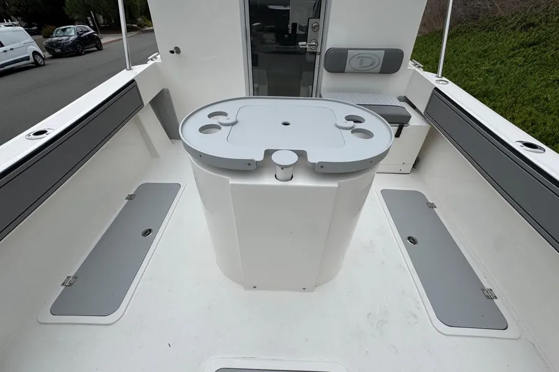 Slide: The Image of 2026 Defiance Admiral 220 EX boat interior with storage compartments and seating. - 24