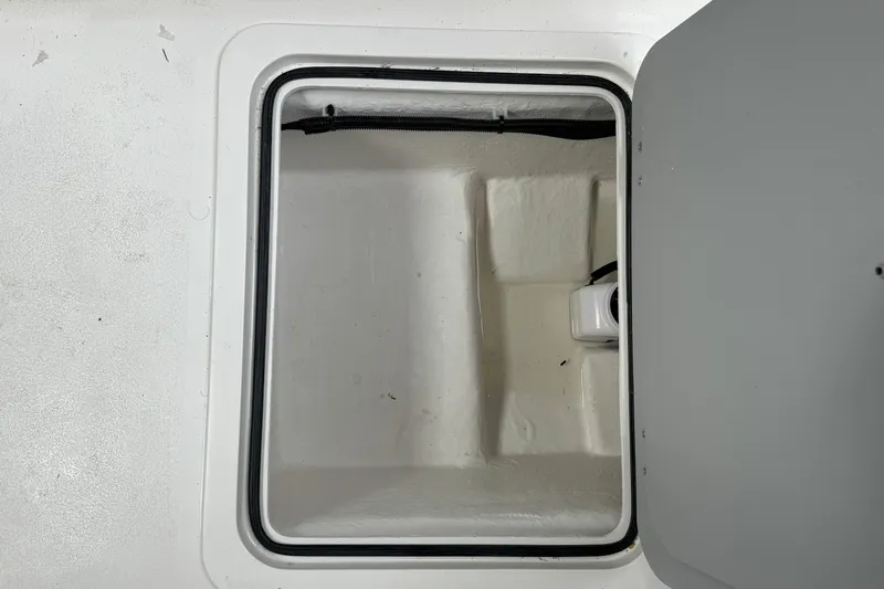 Slide: The Image of Open storage compartment on 2026 Defiance Admiral 220 EX boat. - 36