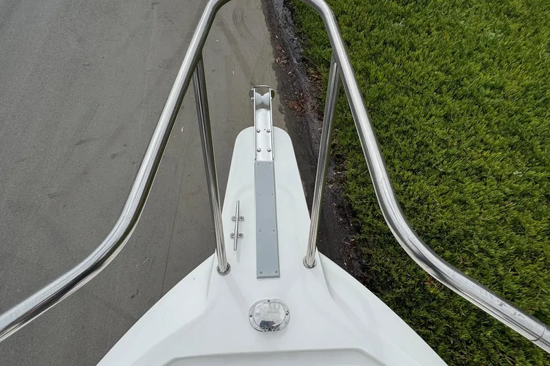 Slide: The Image of Bow view of 2026 Defiance Admiral 220 EX boat with stainless steel railings. - 63