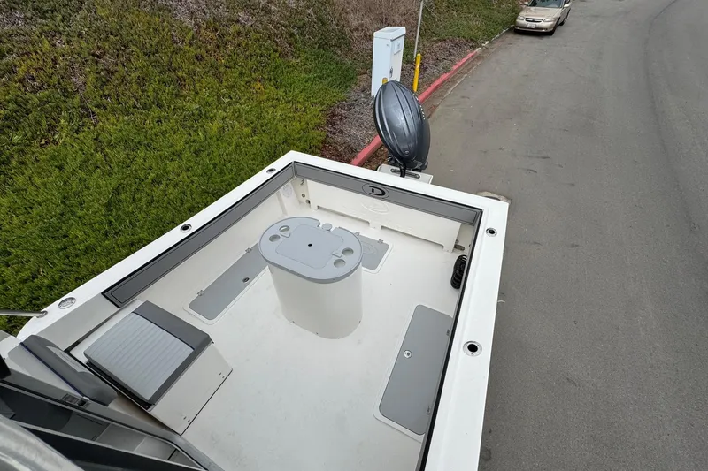 Slide: The Image of 2026 Defiance Admiral 220 EX boat deck with seating and storage compartments. - 65