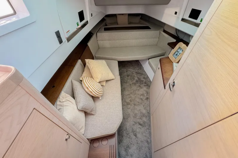 Slide: The Image of 2024 Axopar 45 XC Cross Cabin interior with cozy seating and modern design. - 20