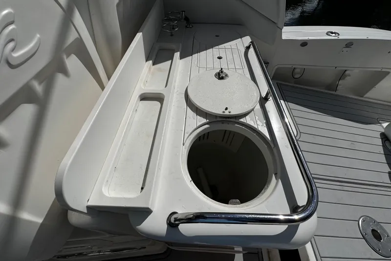 Slide: The Image of Cockpit sink and storage area on 2006 Sea Ray 340 Sundancer boat. - 10