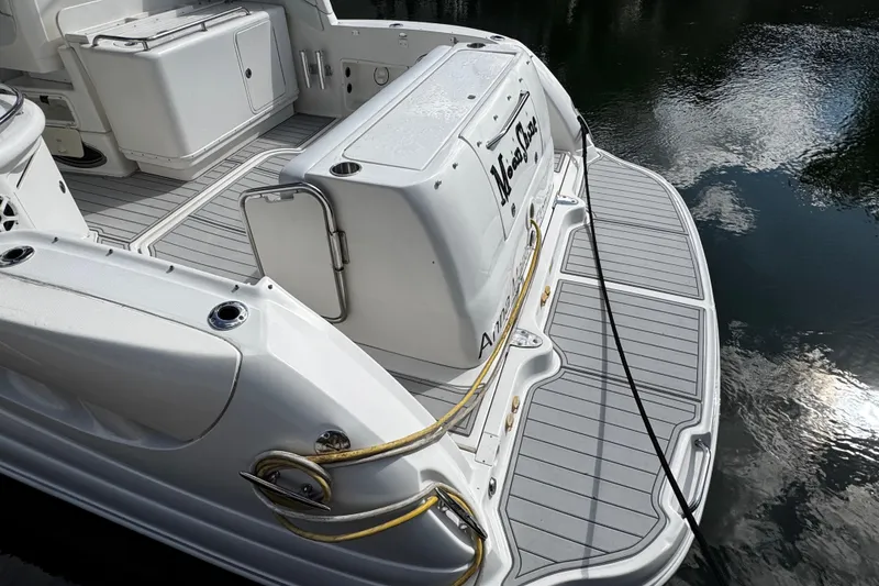 Slide: The Image of 2006 Sea Ray 340 Sundancer boat deck with swim platform and water reflection. - 14