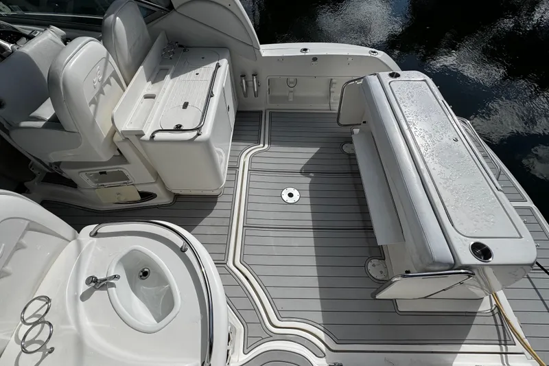 Slide: The Image of 2006 Sea Ray 340 Sundancer boat deck with seating and storage compartments. - 16